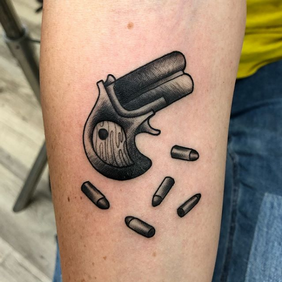 tattoo women gun.png